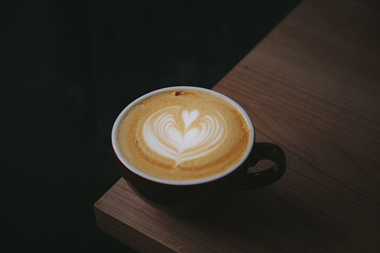 Close-up of cappuccino on table