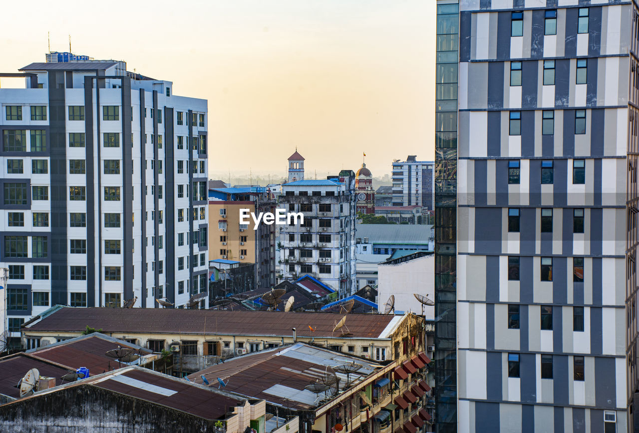 High angle view of buildings in city against sky