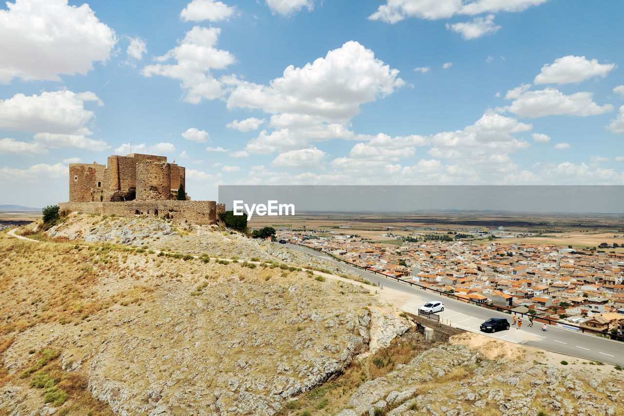 high angle view of townscape against cloudy sky