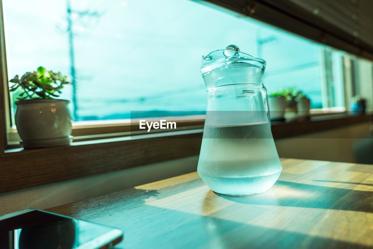 CLOSE-UP OF JUICE ON TABLE