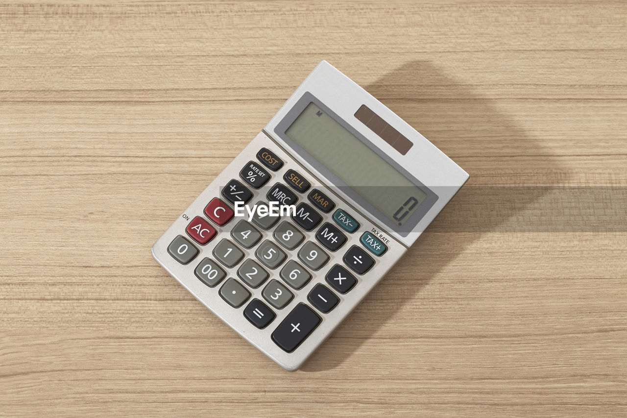 High angle view of calculator on table