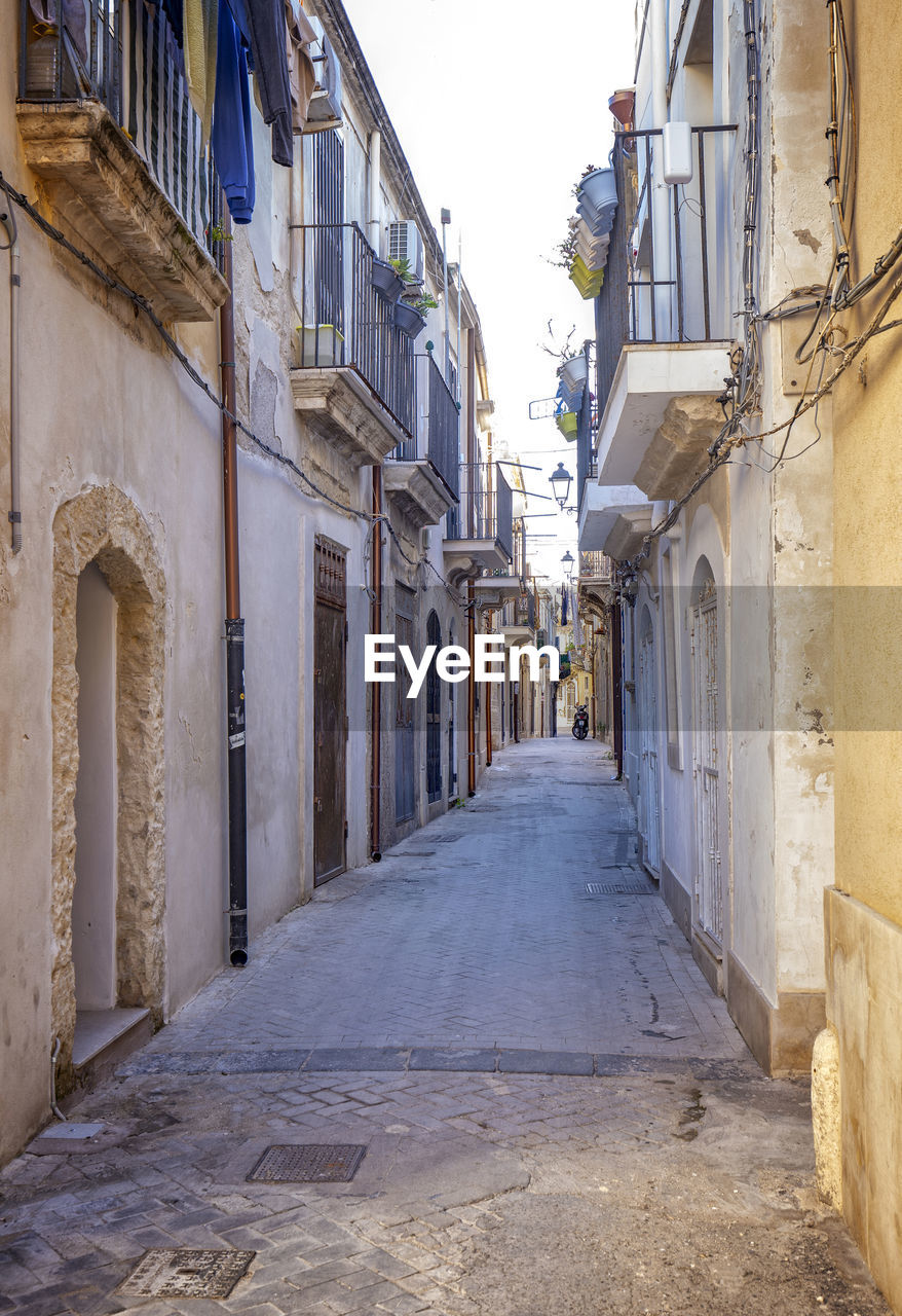 Typical small street on the island of ortigia, syracuse in sicily, italy