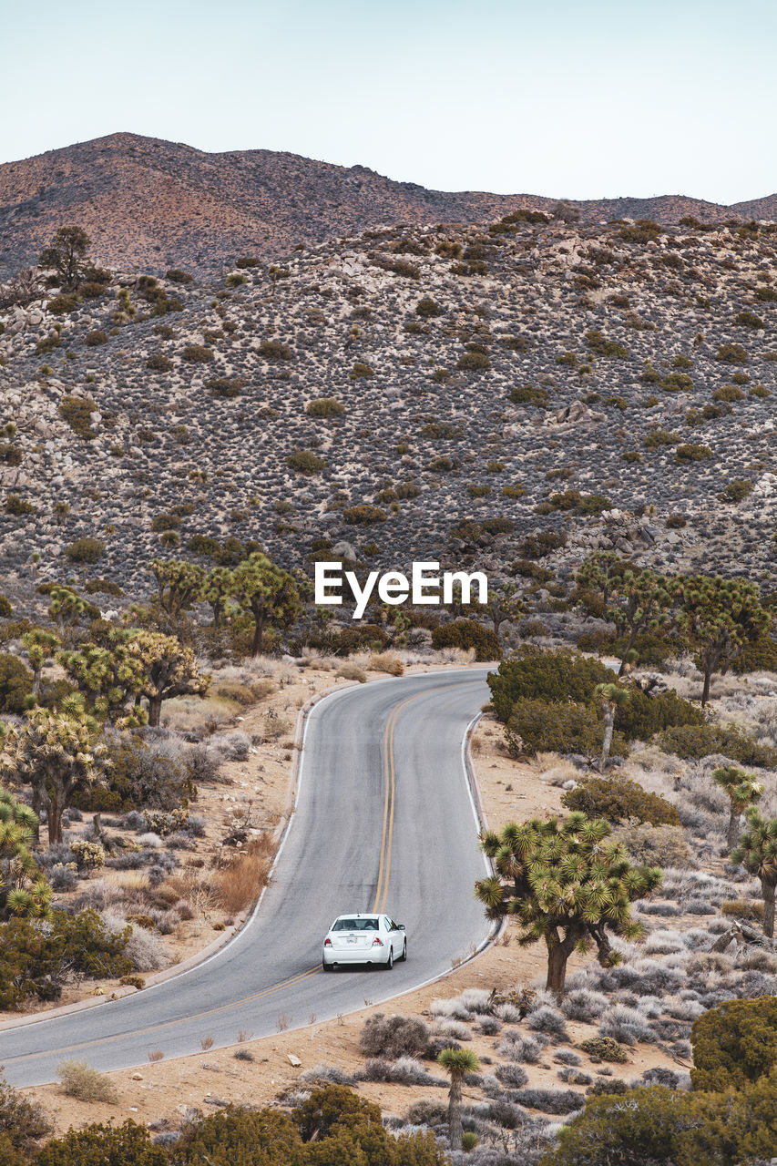 High angle view of car on road leading towards mountains