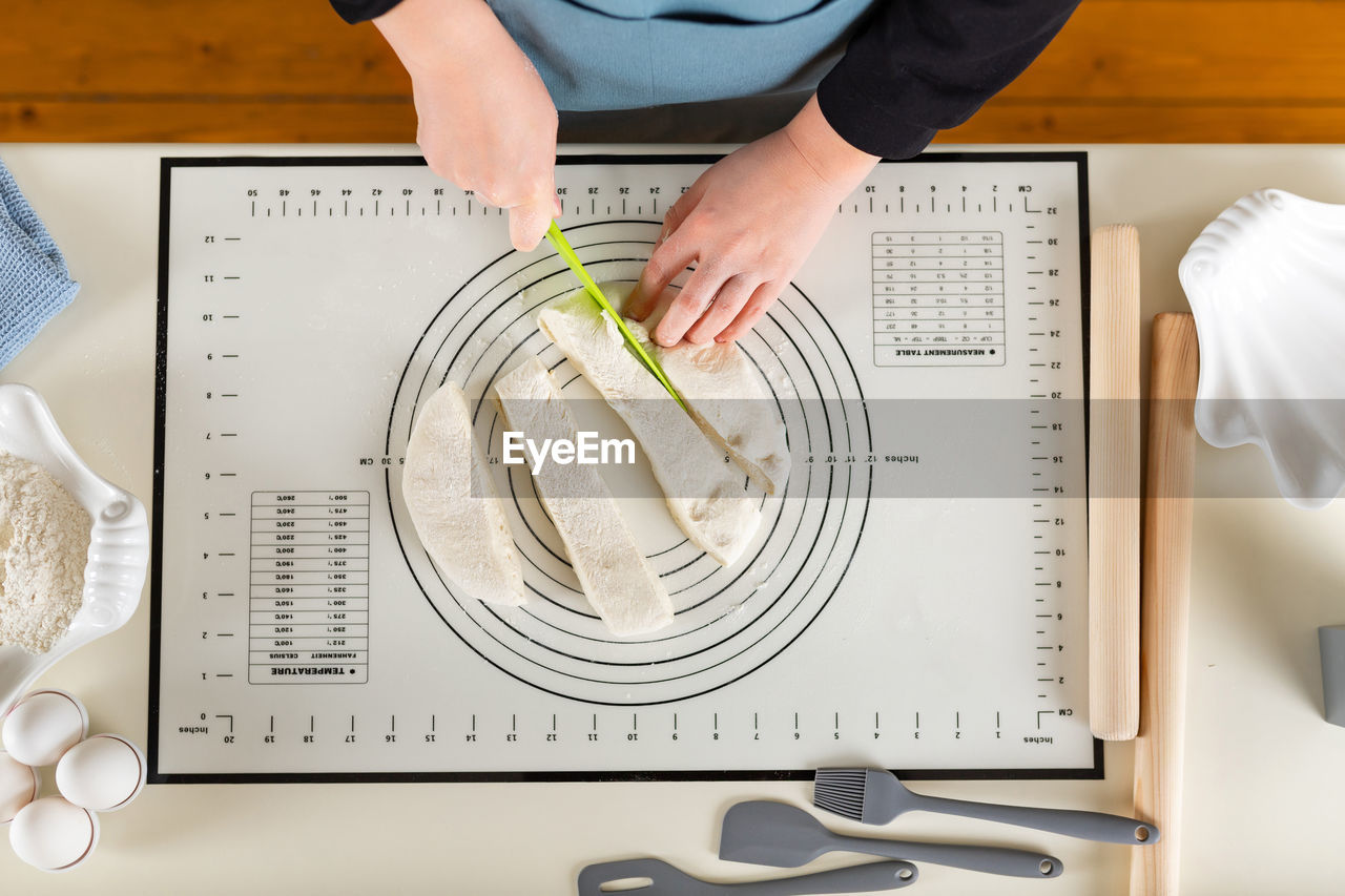 high angle view of man working on table