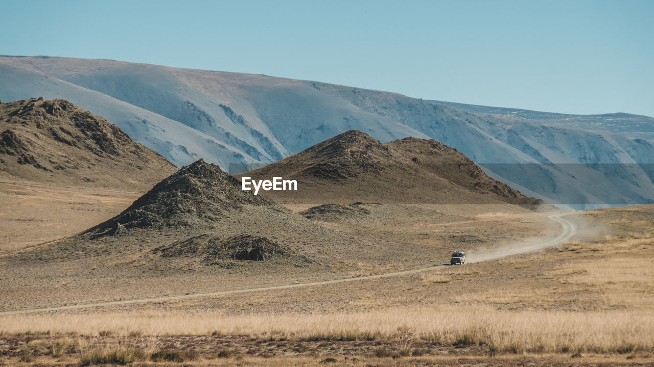 Scenic view of desert against clear sky