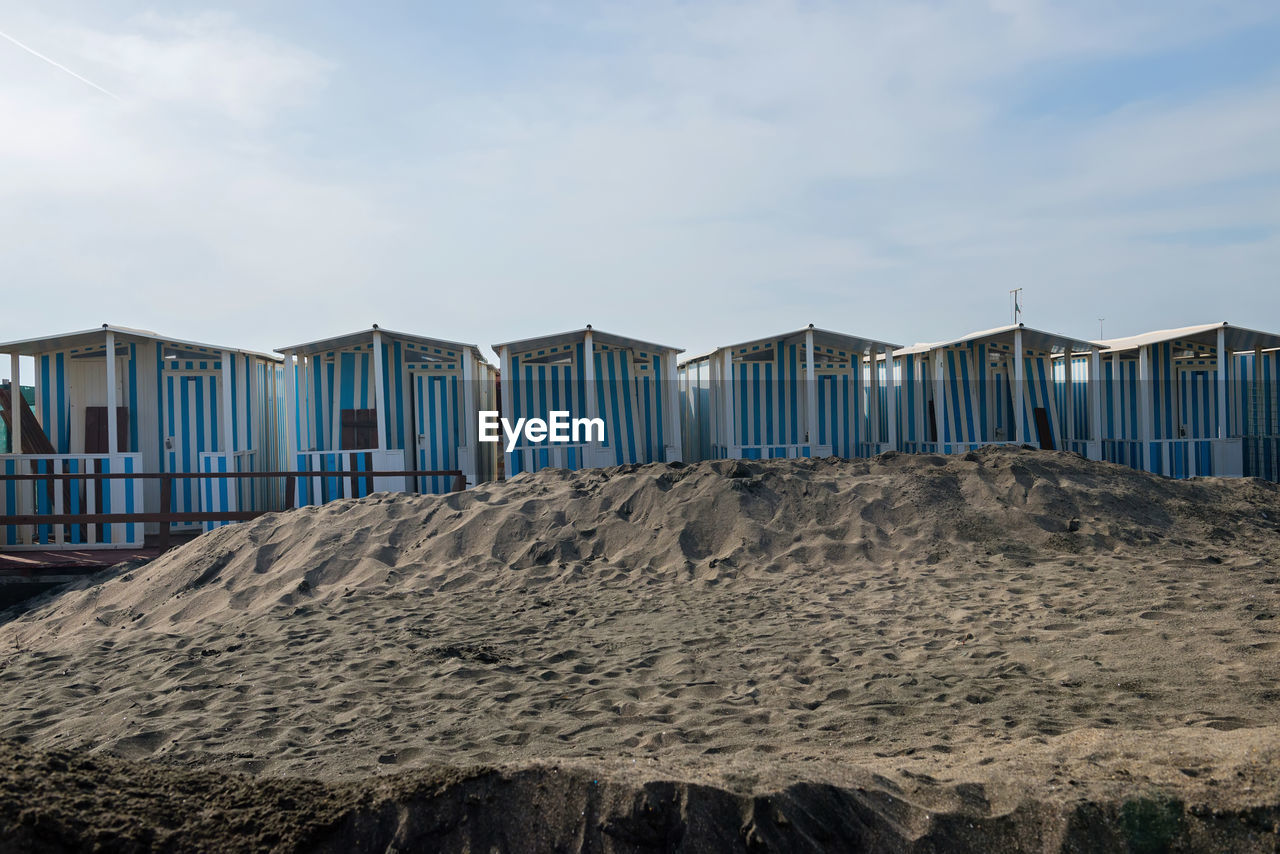 Beach huts against sky