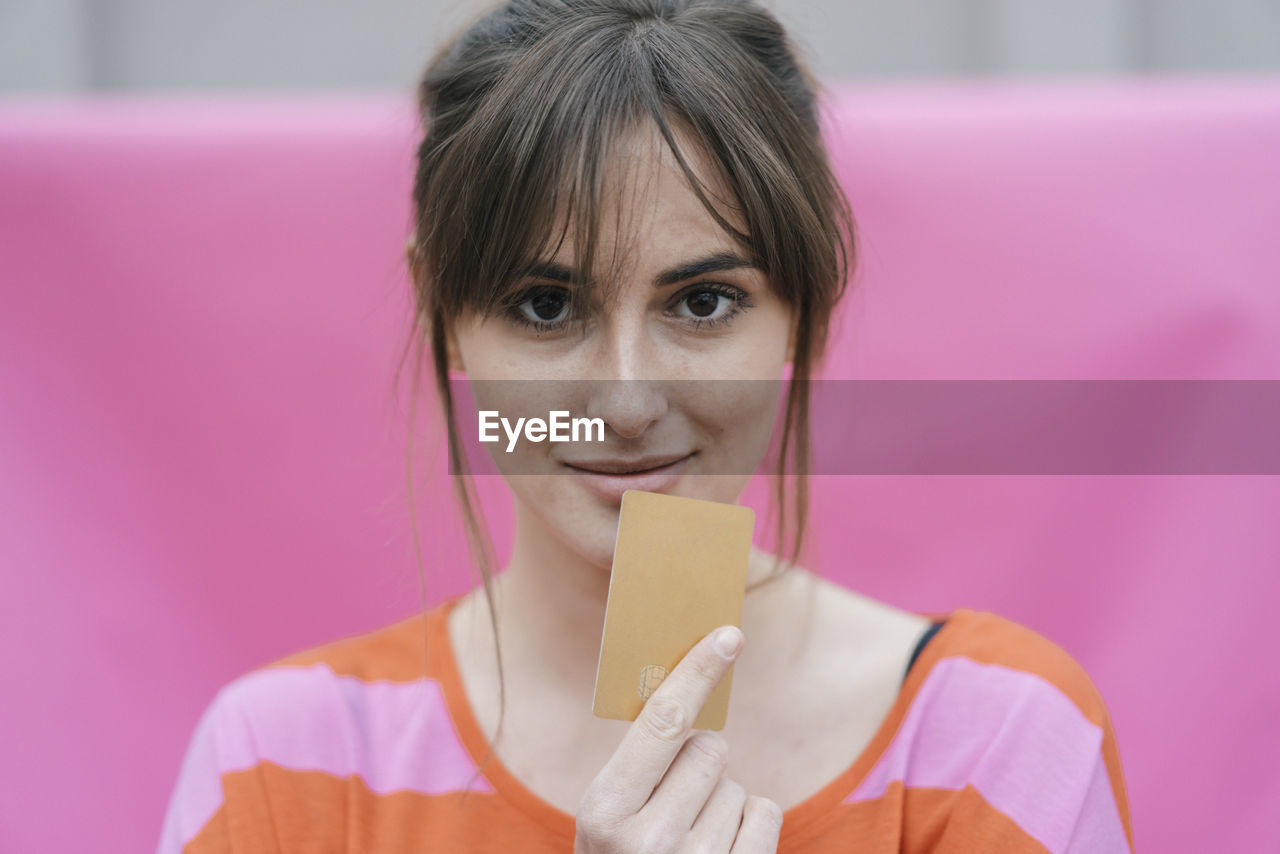 Woman holding credit card