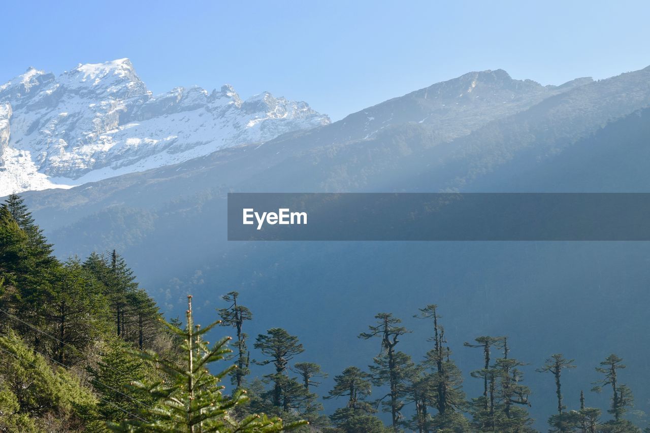 Scenic view of mountains against sky during winter