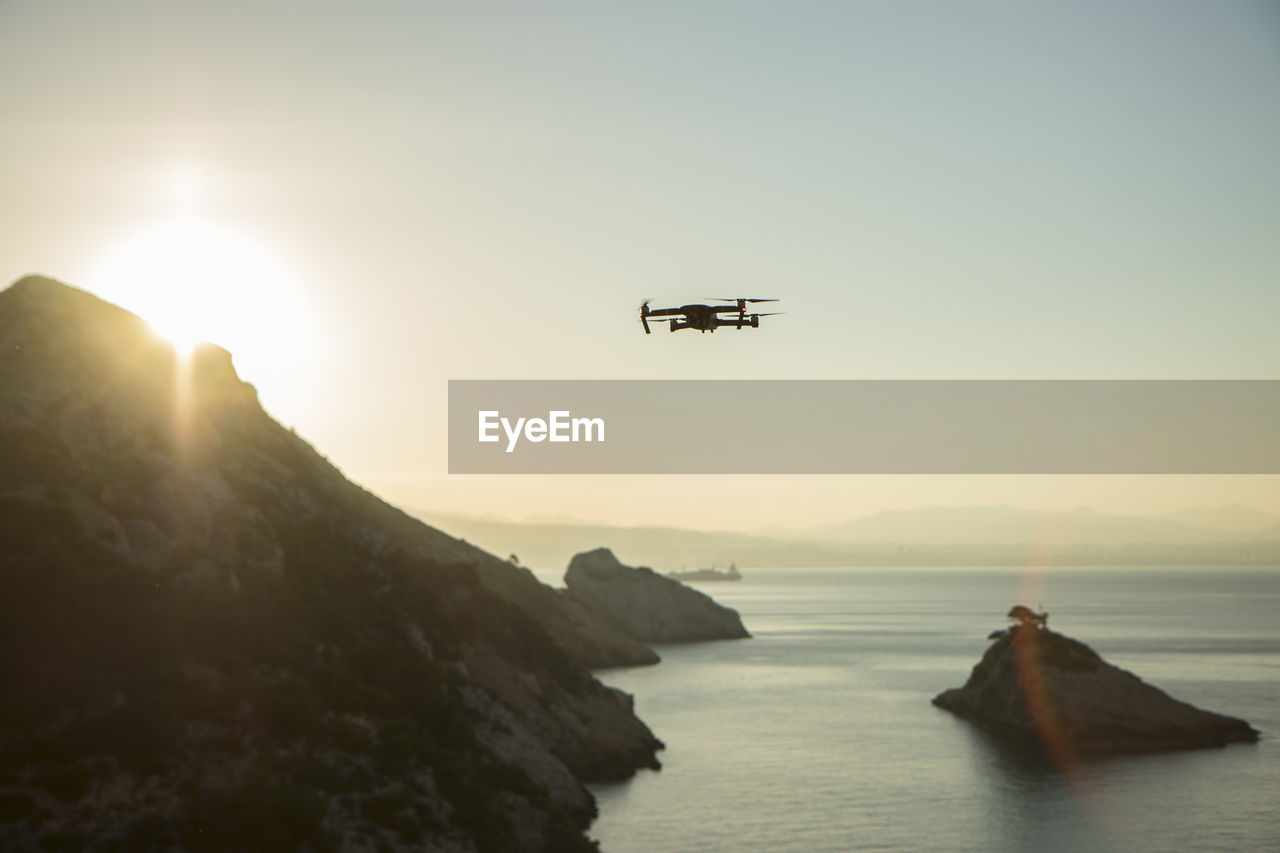 Scenic view of sea against clear sky during sunset