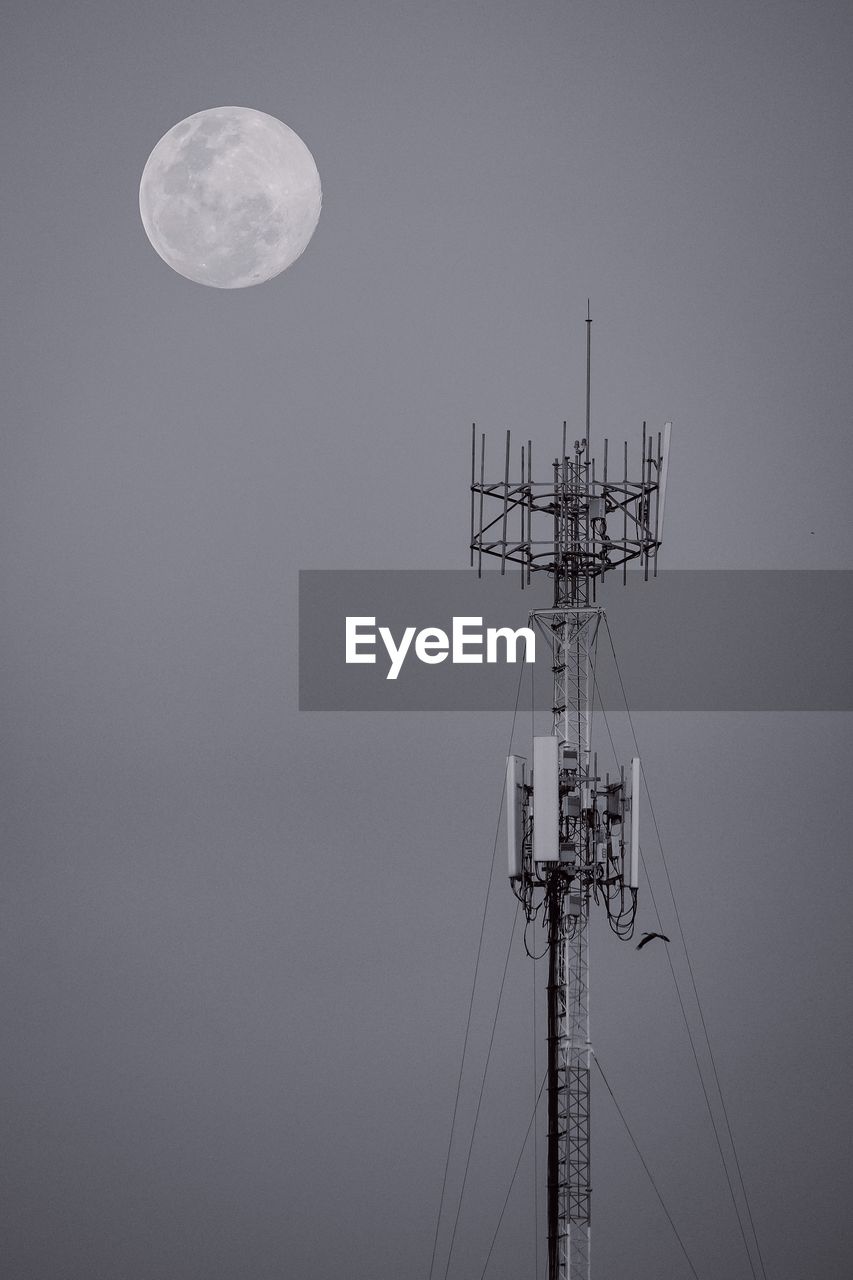 Signal towers and full moon background