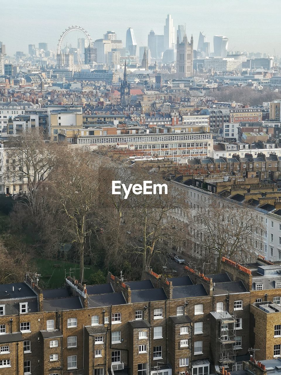 HIGH ANGLE SHOT OF TOWNSCAPE AGAINST SKY