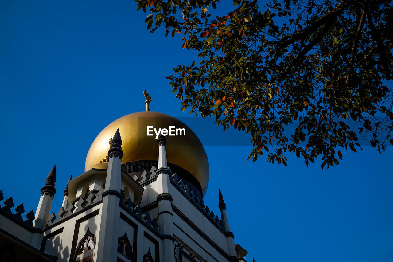 Low angle view of church against clear blue sky