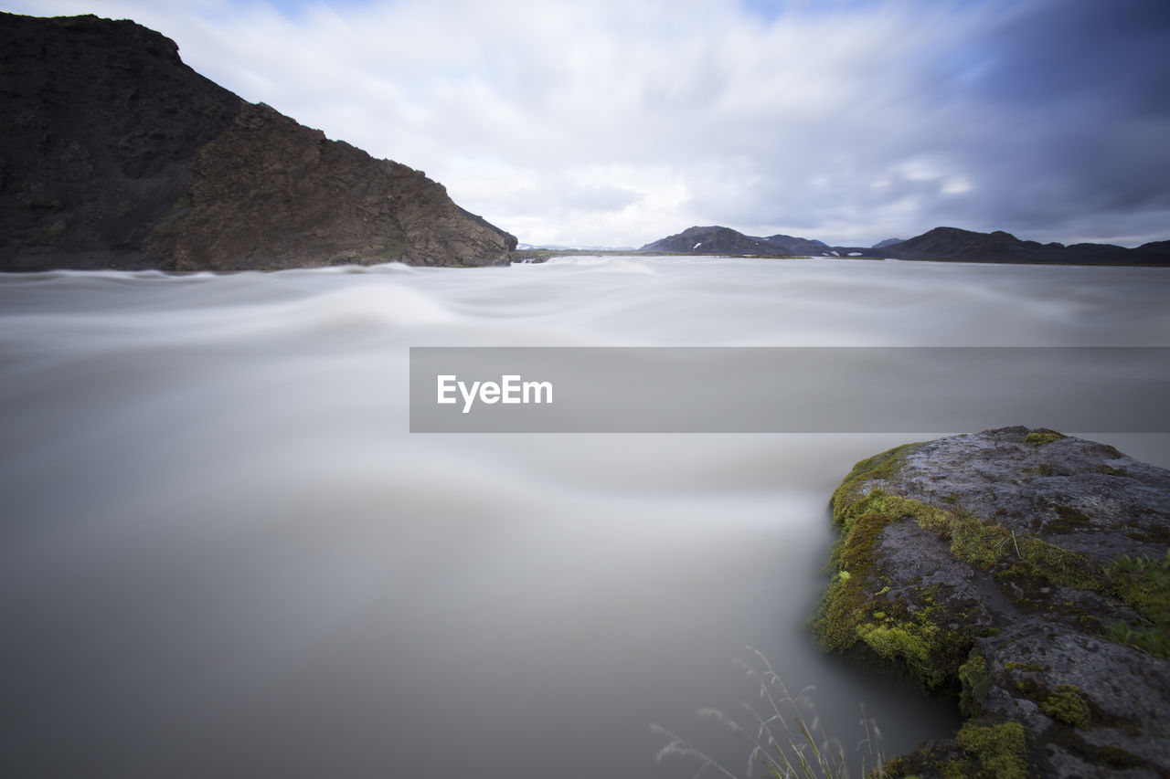 SCENIC VIEW OF ROCKS AGAINST SKY