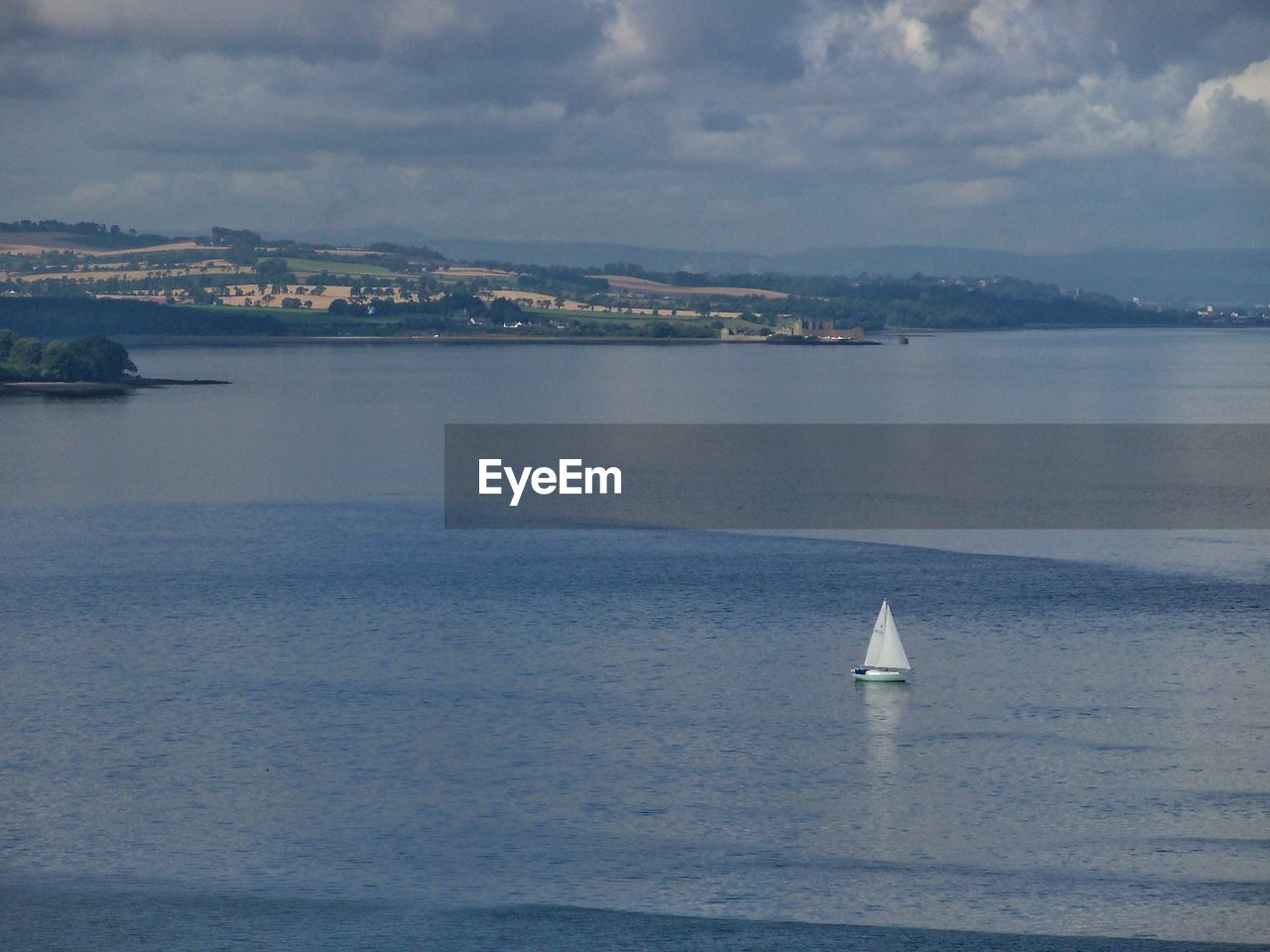 SAILBOATS SAILING IN SEA AGAINST SKY