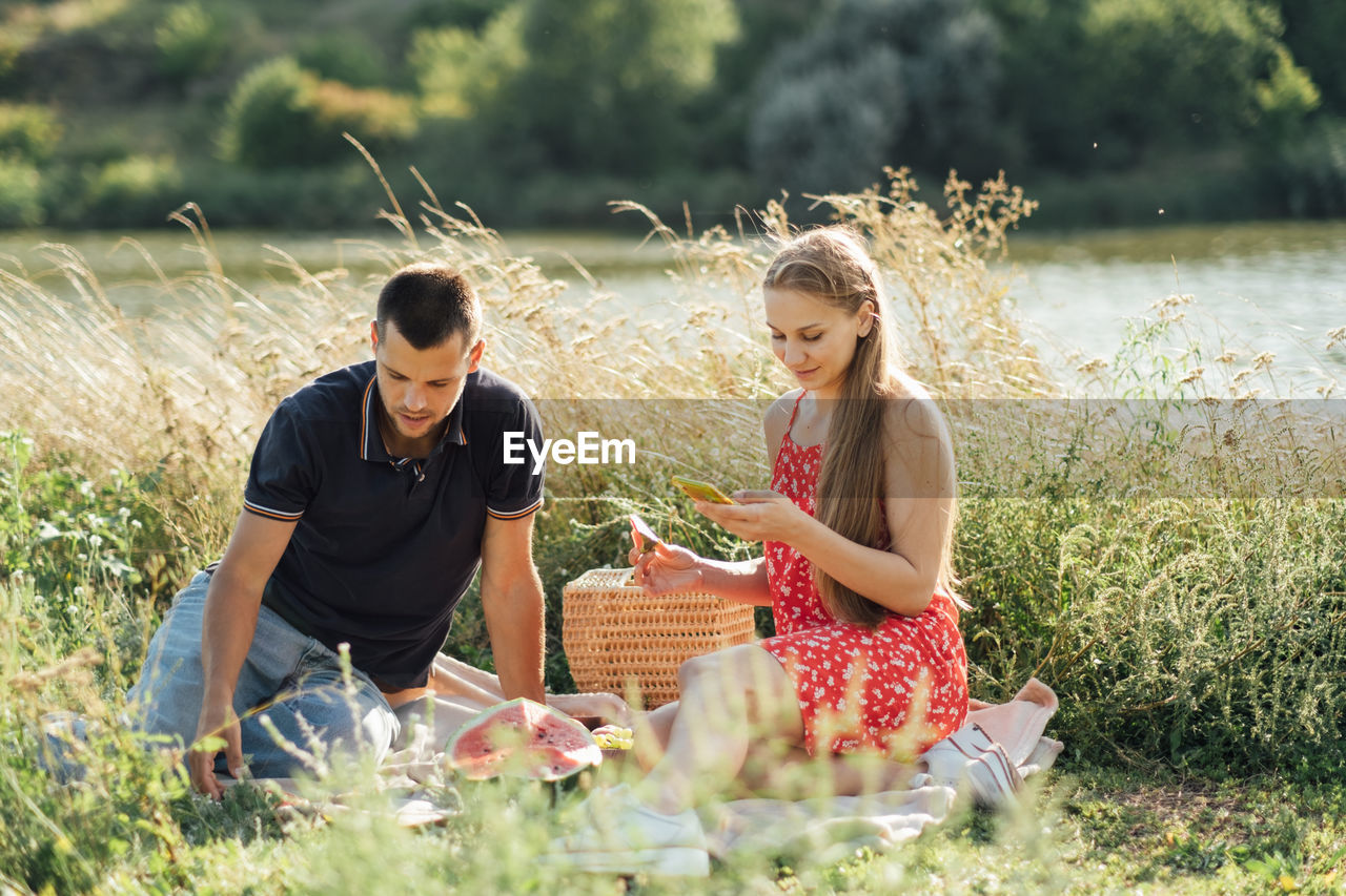 Social media internet addiction, phubbing. young couple reading social media on their smart phones