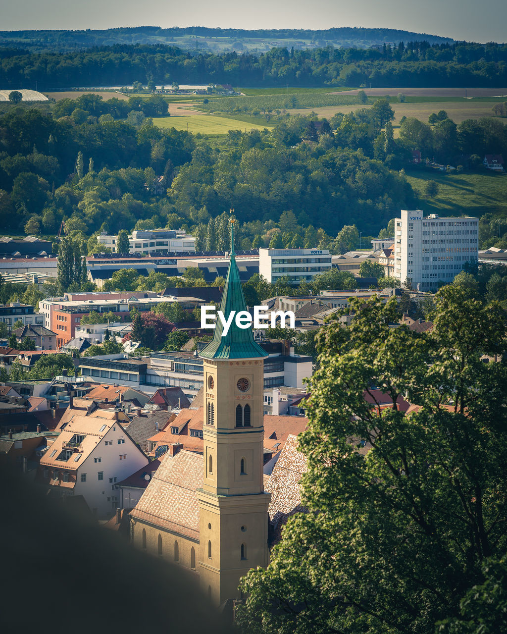 HIGH ANGLE VIEW OF TOWNSCAPE BY TREES AND BUILDINGS