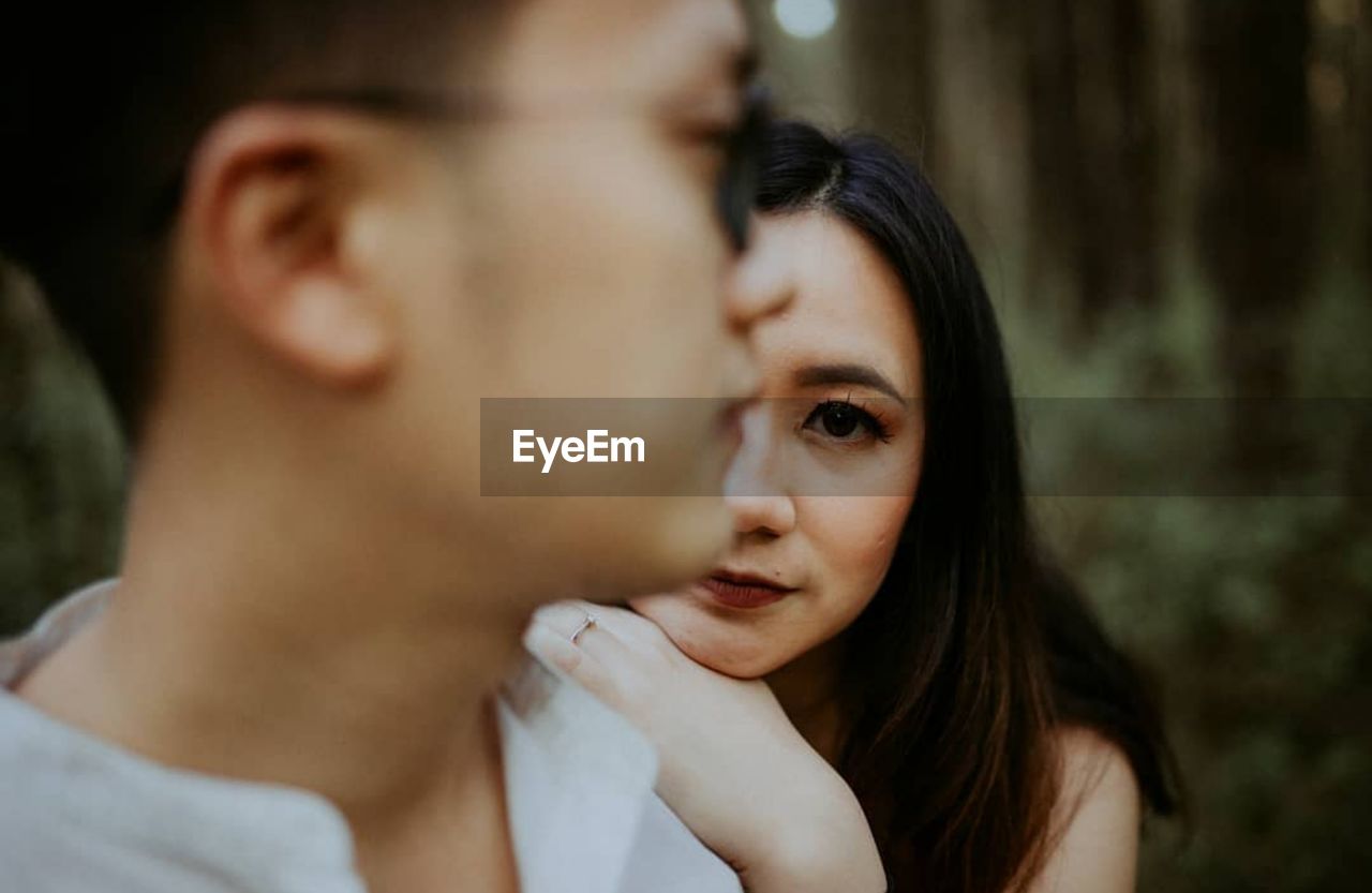 Close-up of couple standing outdoors