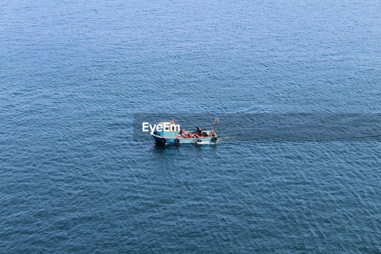 High angle view of man on boat in sea