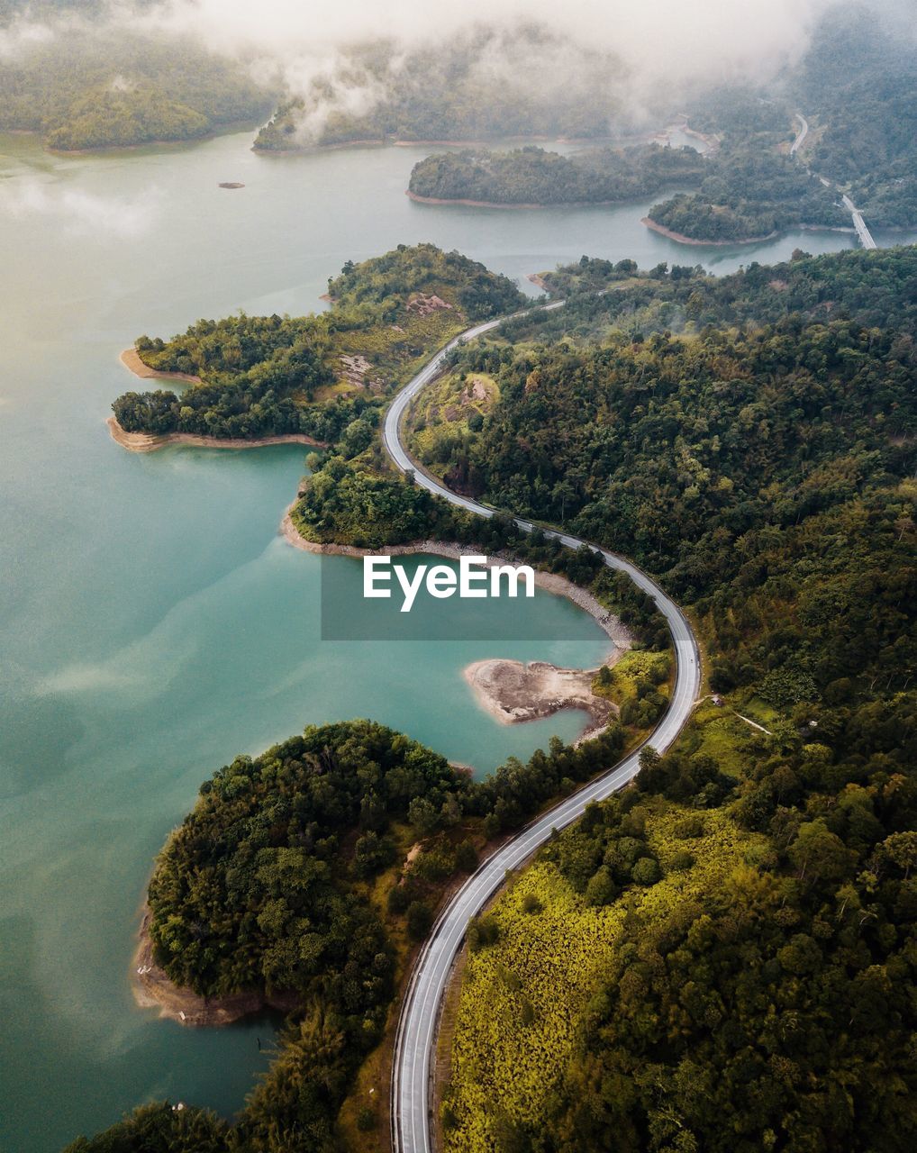 High angle view of road by mountains and sea