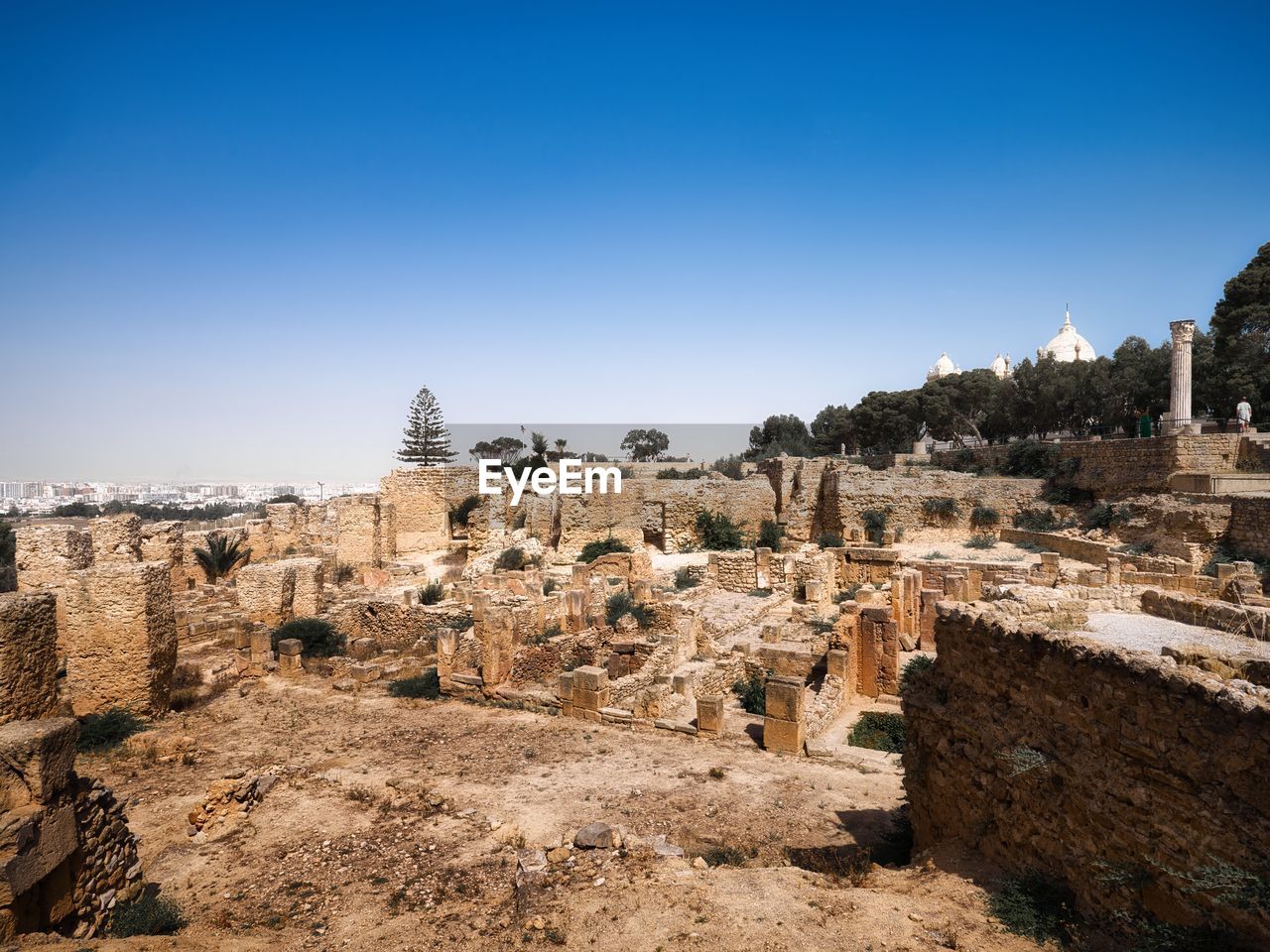 architecture, history, ancient history, sky, travel destinations, ancient, the past, ruins, travel, nature, clear sky, old ruin, blue, built structure, rock, no people, environment, landscape, land, tourism, landmark, ancient civilization, temple, scenics - nature, sunny, building exterior, outdoors, archaeology, wadi, building, religion, day, stone material, old