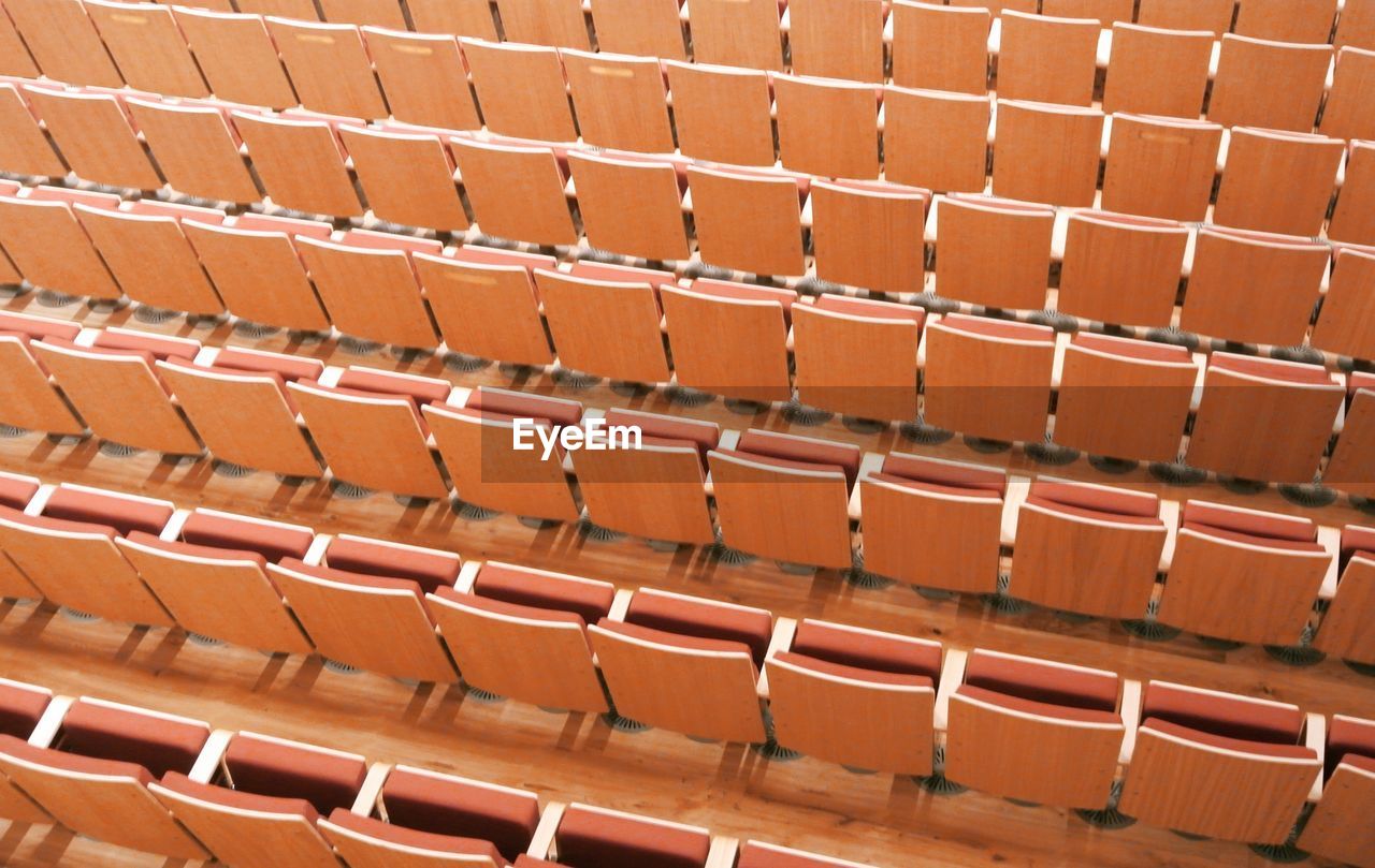 Full frame shot of empty chairs in stadium