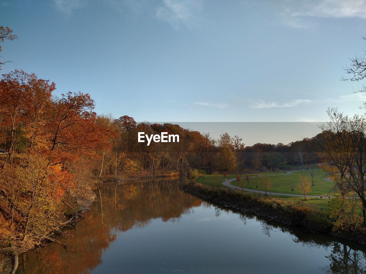 SCENIC VIEW OF LAKE BY TREES AGAINST SKY