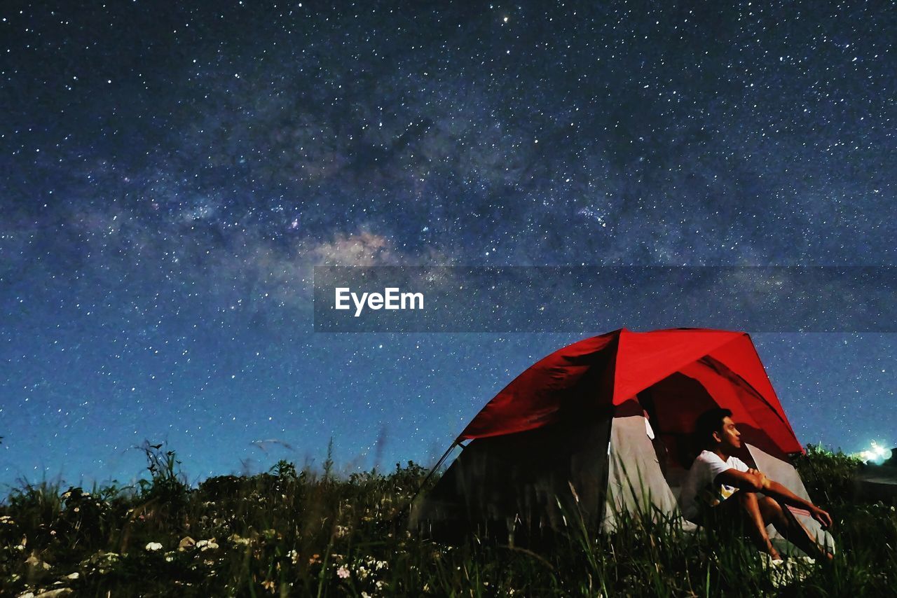 Tent against star field at night