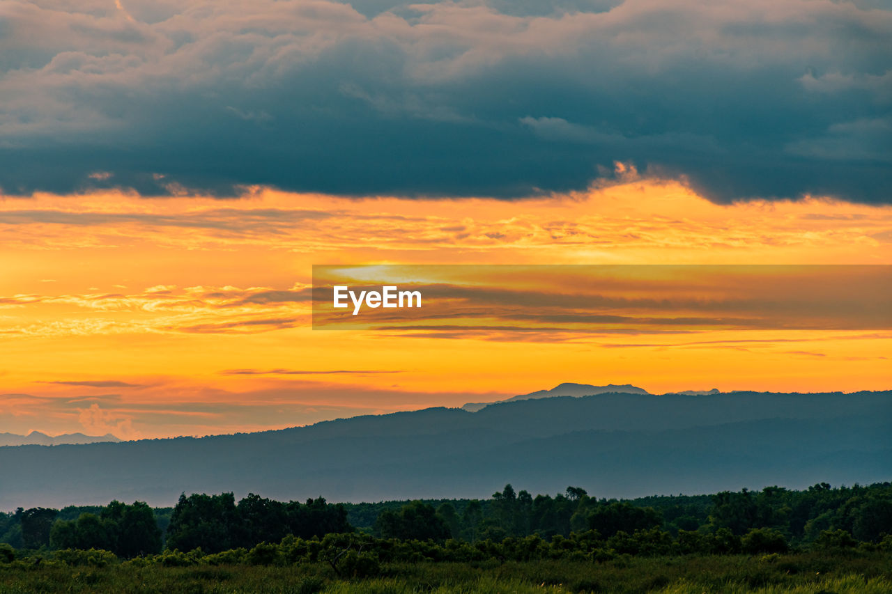 Scenic view of dramatic sky during sunset