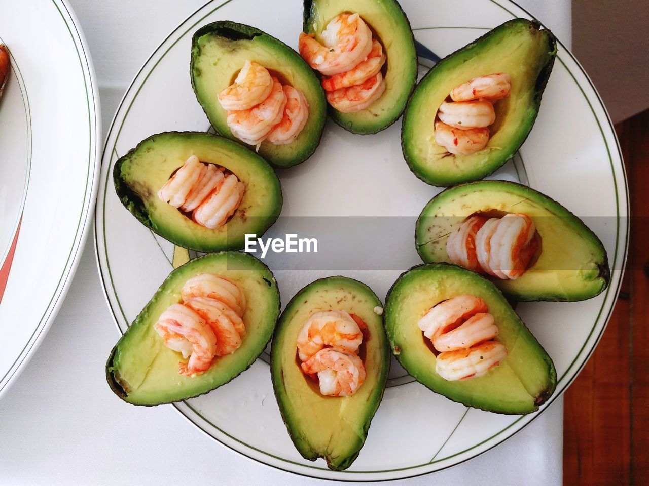 Close-up of avocados with shrimp in plate