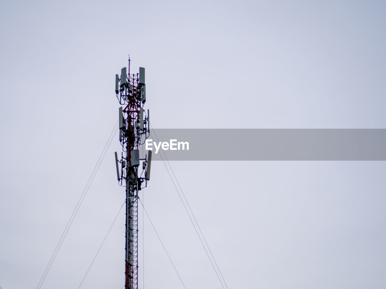 Low angle view of communications tower against clear sky