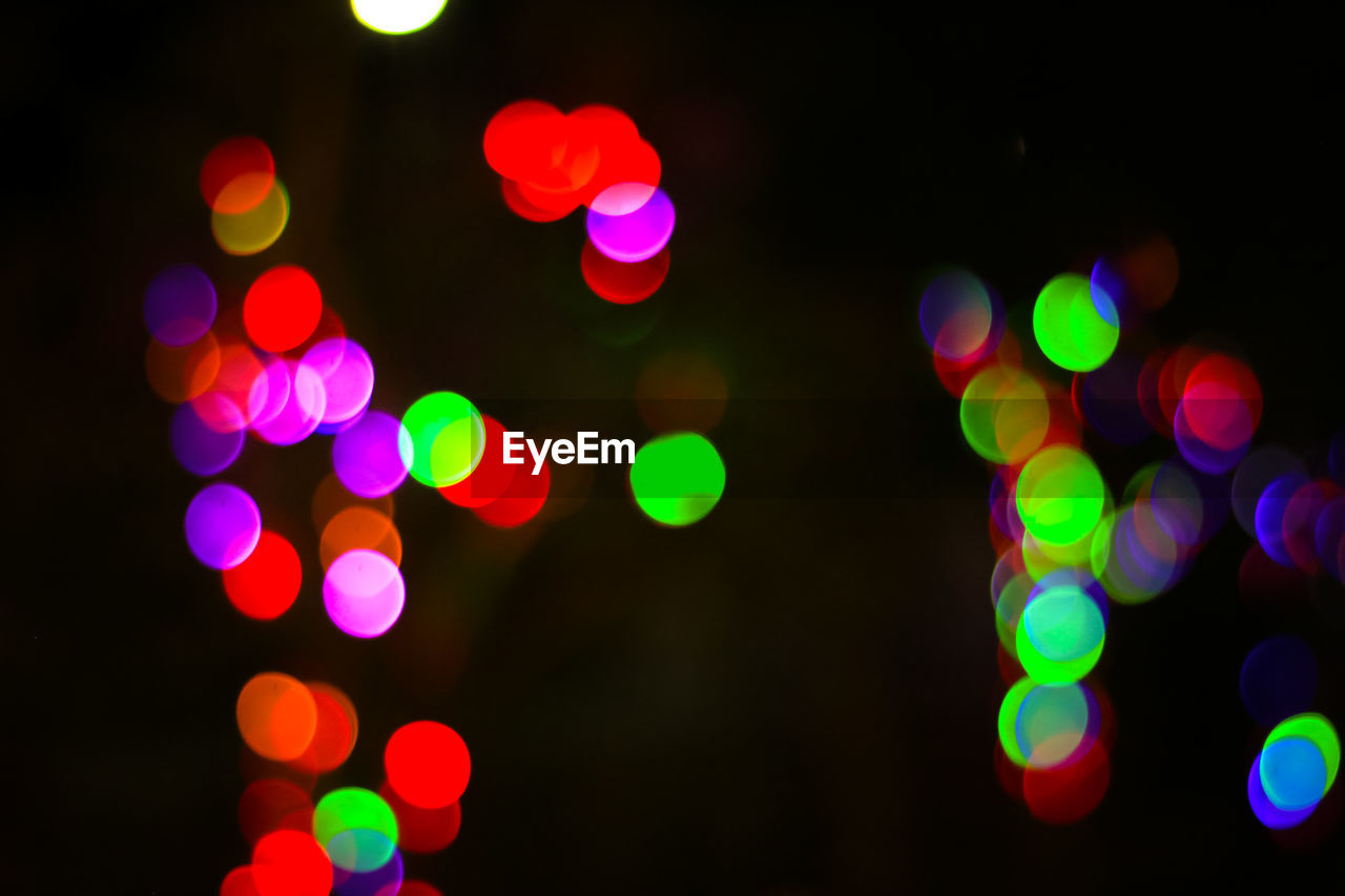 Defocused image of illuminated colorful lights