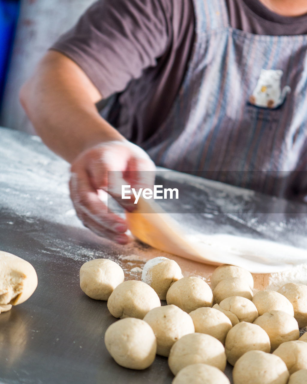 Close-up of person preparing food chapatti