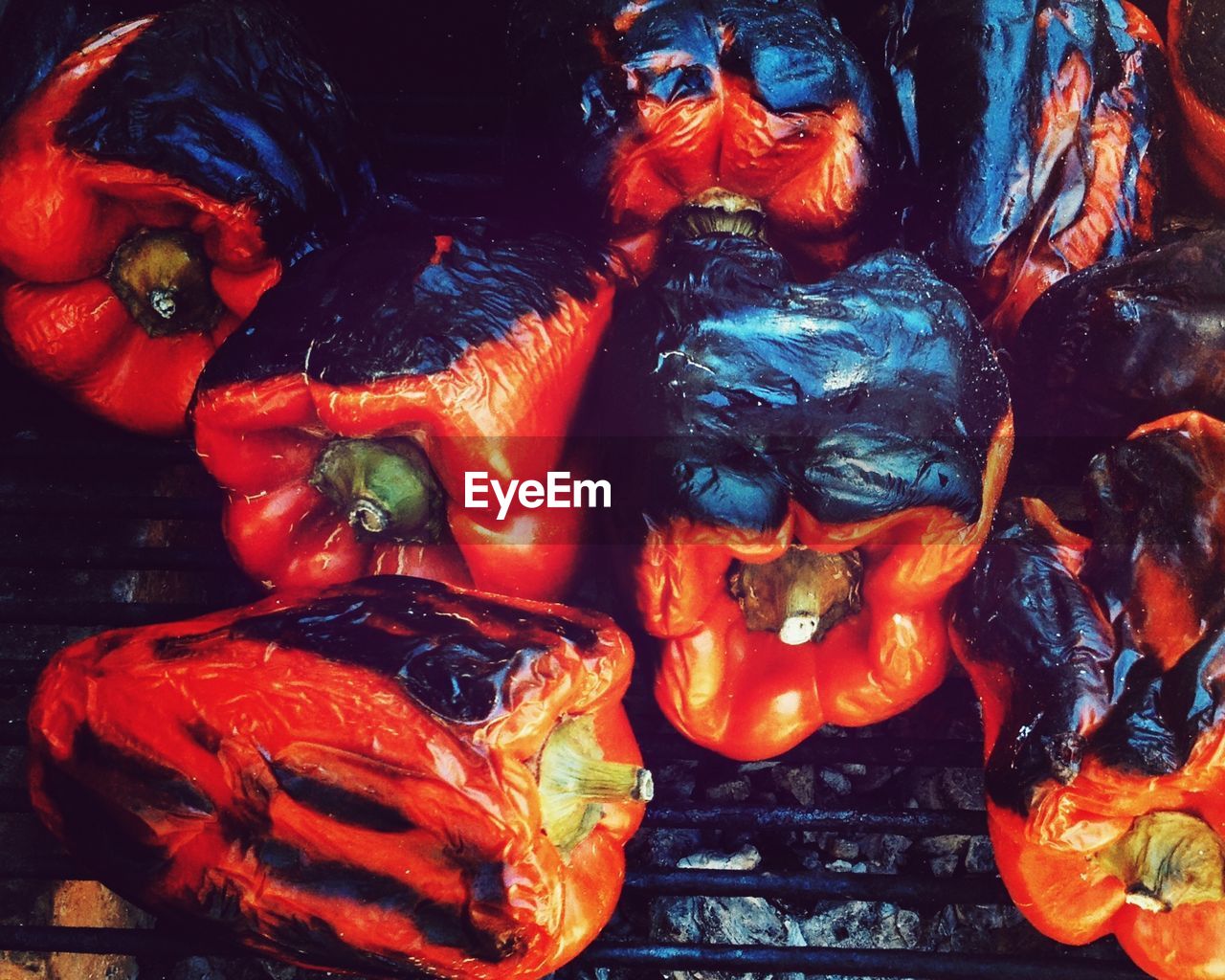 Close-up of red bell peppers on barbecue grill