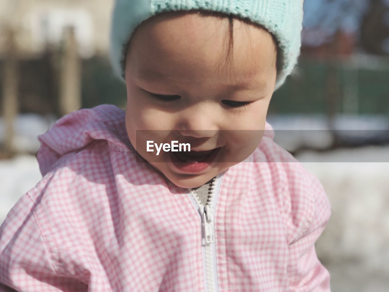 Close-up of cute baby girl wearing warm clothing
