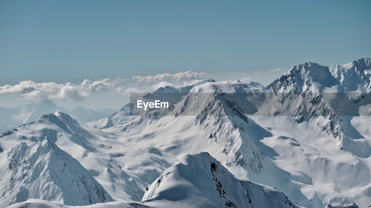 Scenic view of snowcapped mountains against sky