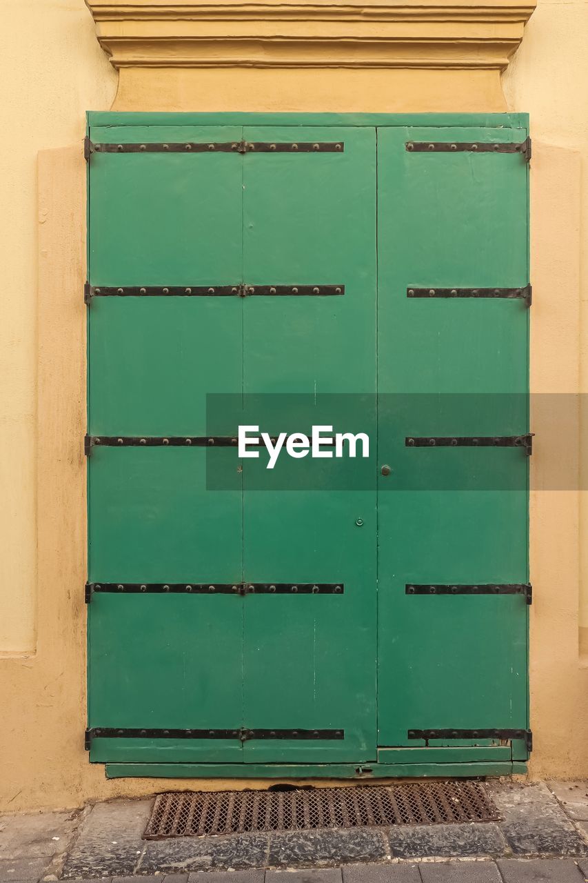 architecture, green, building, furniture, door, no people, entrance, built structure, wall, building exterior, closed, wall - building feature, wood, protection, container, industry, security, outdoors, house, city, day