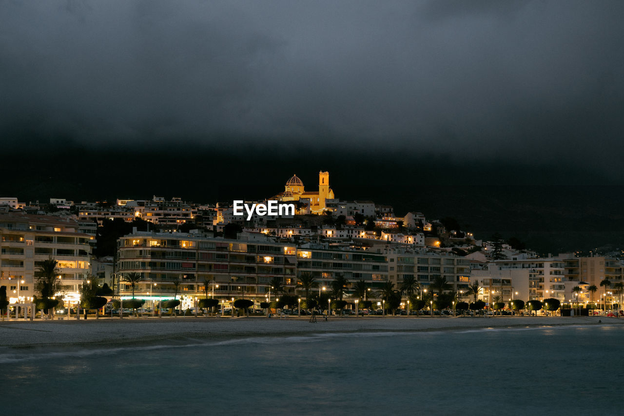 Illuminated buildings in city at night