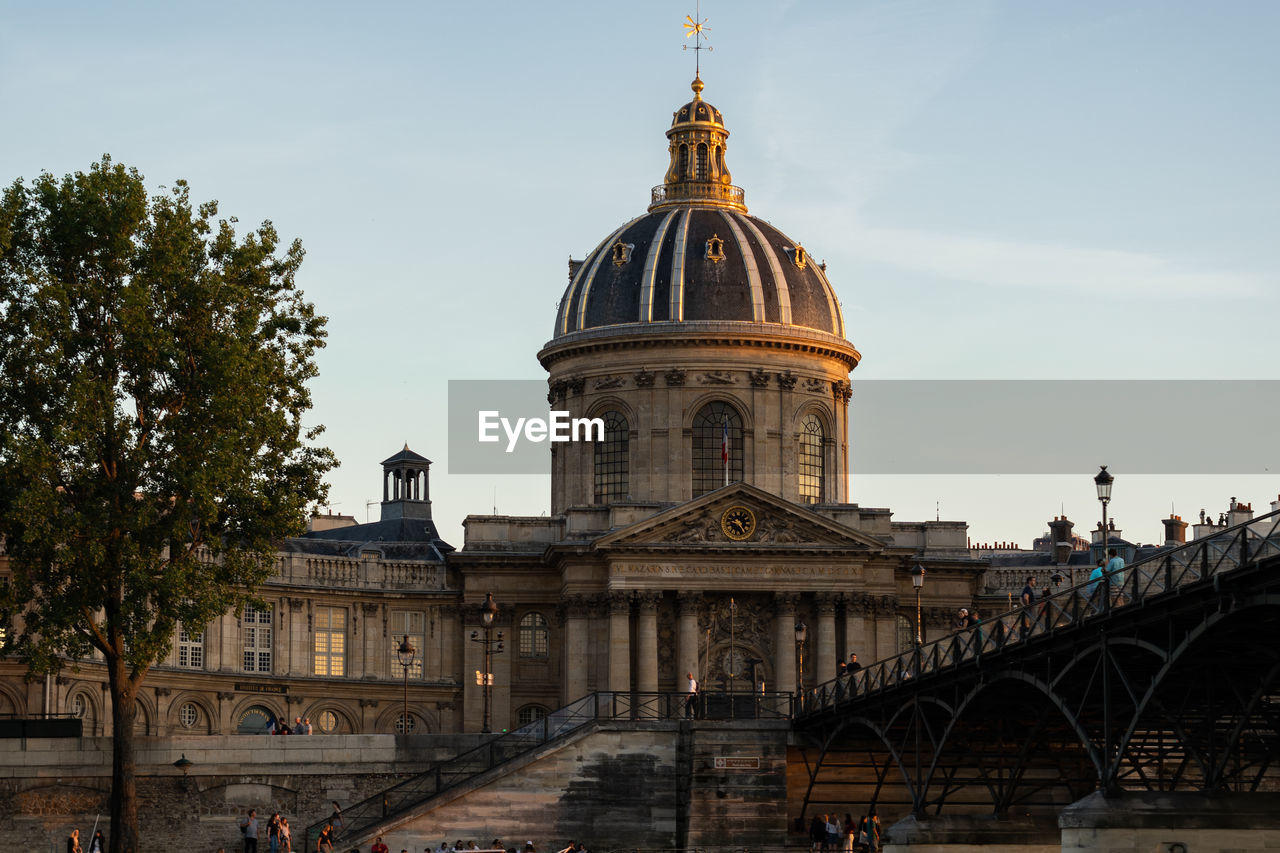 View of institute of france against sky in city. from the pont des arts. paris-france, 31. may 2019.