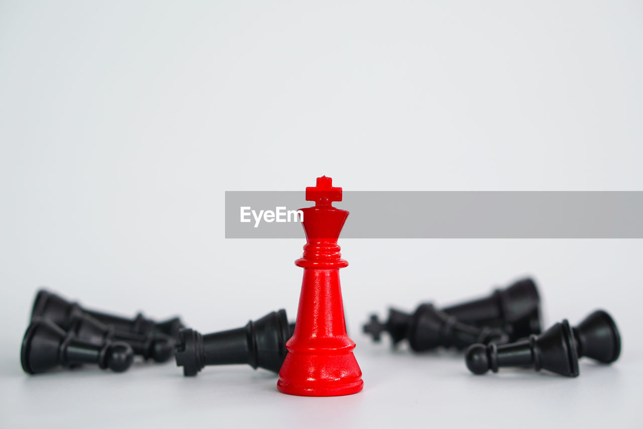 Close-up of chess pieces against white background