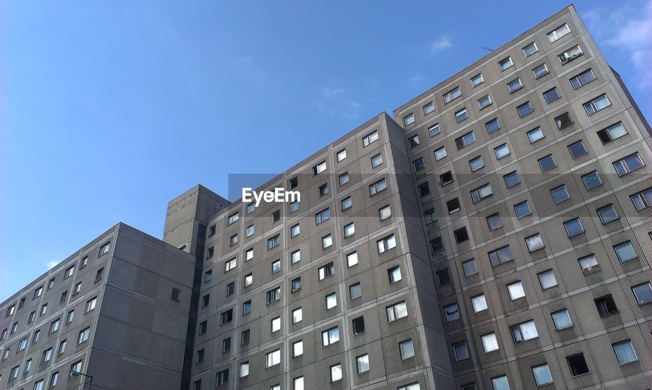 Apartment building against blue sky