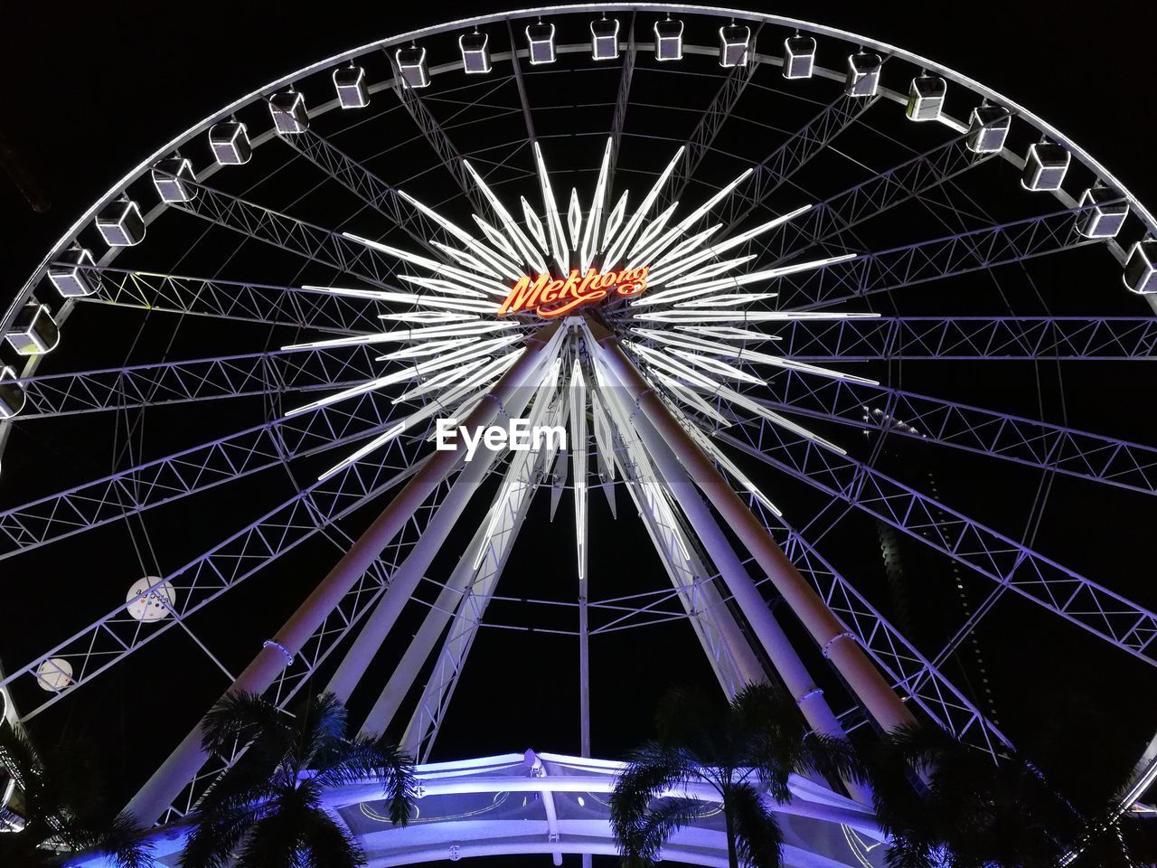 LOW ANGLE VIEW OF ILLUMINATED FERRIS WHEEL