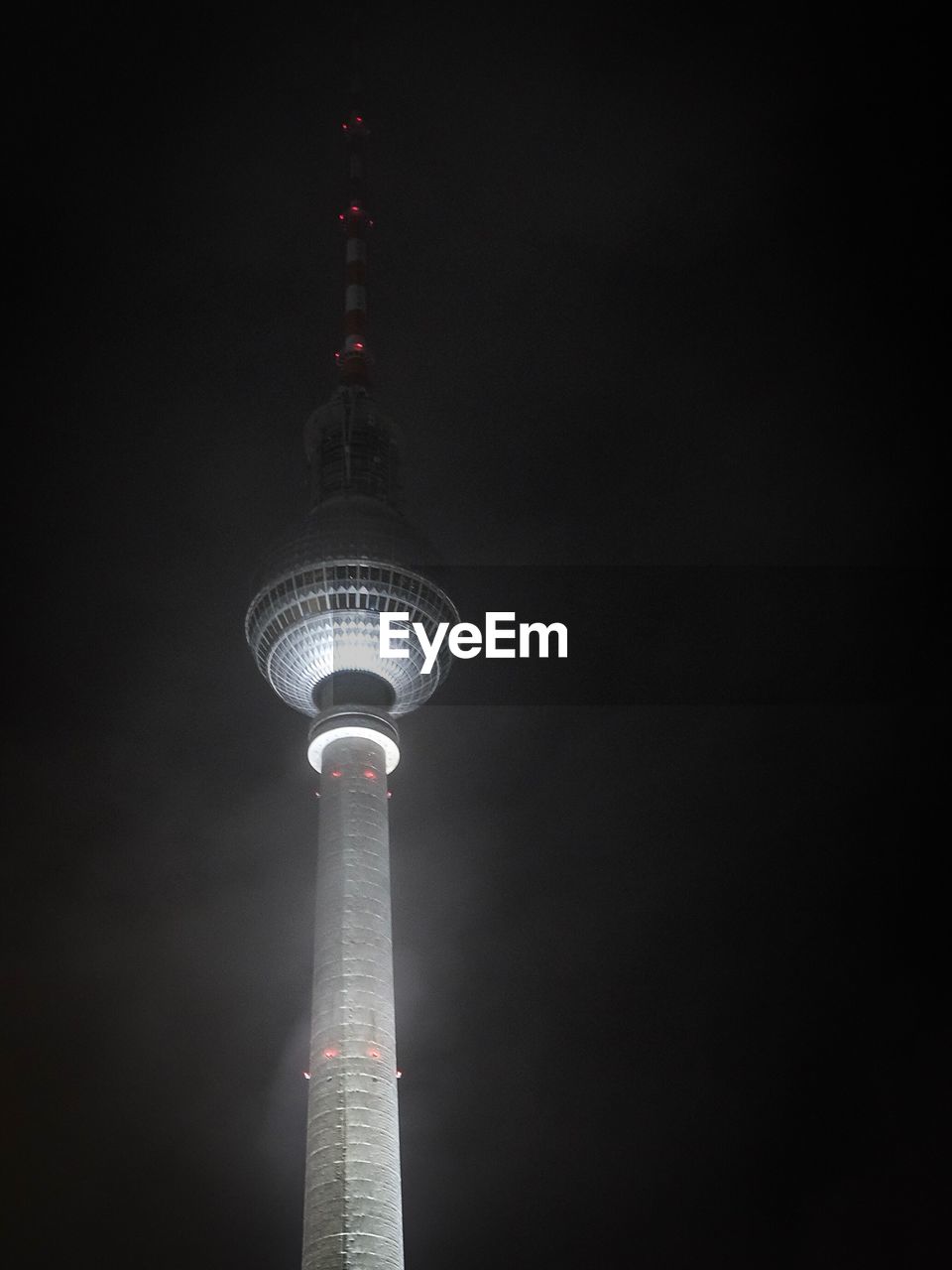 LOW ANGLE VIEW OF COMMUNICATIONS TOWER AGAINST SKY