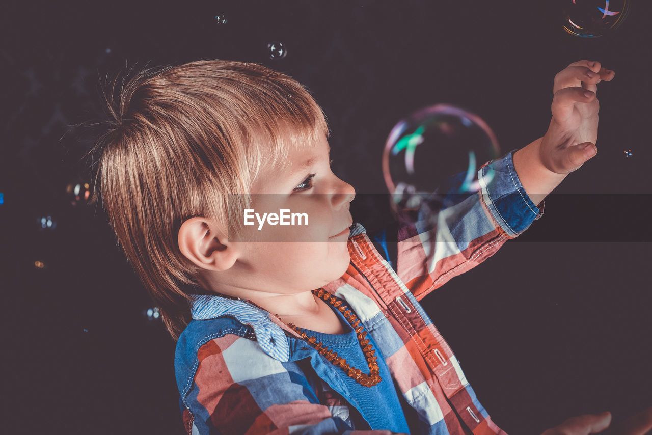 Portrait of cute boy looking away