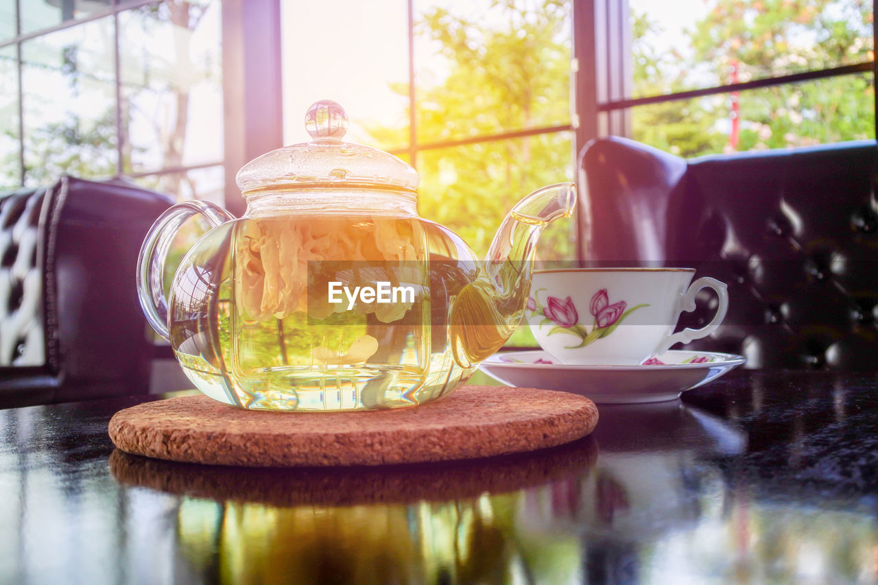 CLOSE-UP OF TEA SERVED ON TABLE AT HOME