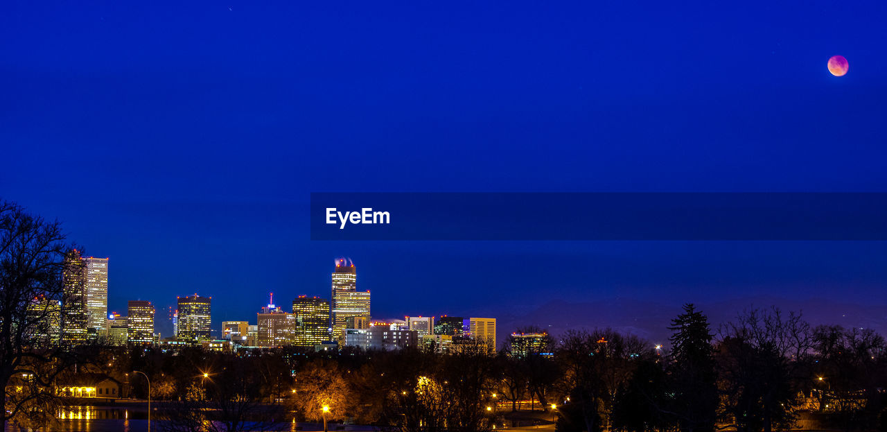 View of city lit up at night