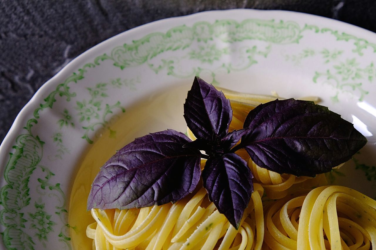 High angle view of pasta and red basil