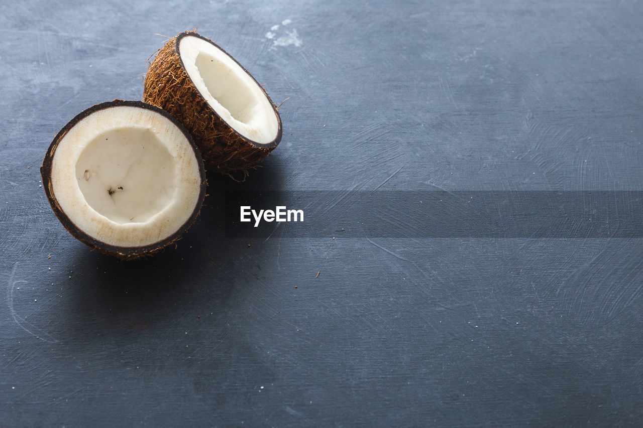 HIGH ANGLE VIEW OF COFFEE CUP ON TABLE WITH SPOON