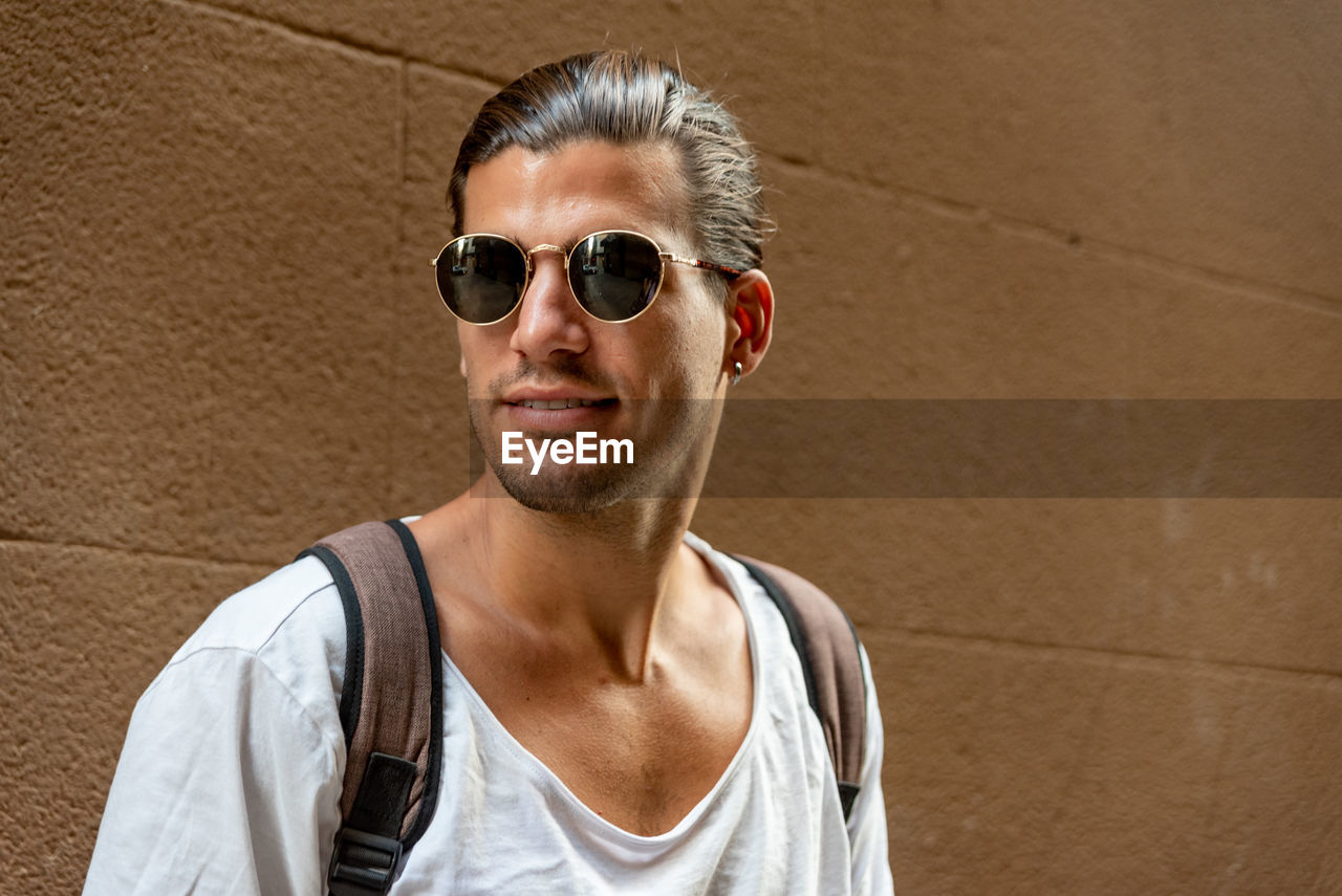 Portrait of young latin man with sun glasses