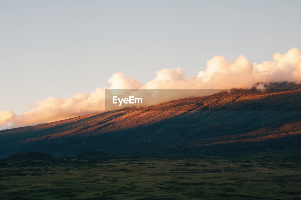 Scenic view of landscape against sky during sunset