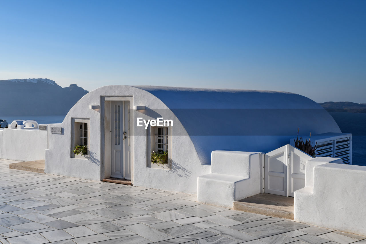 VIEW OF BUILDINGS AGAINST BLUE SKY